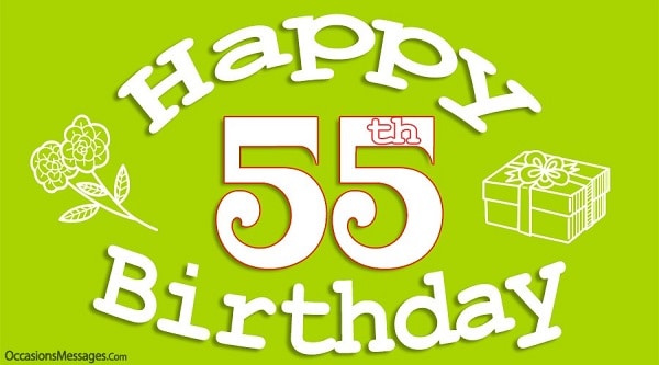 Bílý nápis "Happy 55th birthday" na zeleném pozadí. 
