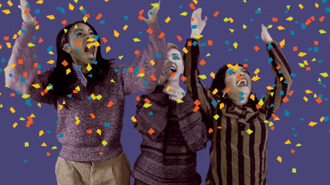 GIF přání k jmeninám oslavující lidi s konfetami. 