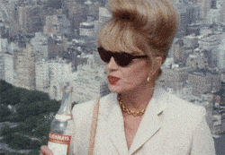 GIF blahopřání k jmeninám blondýna s flaškou vodky. 