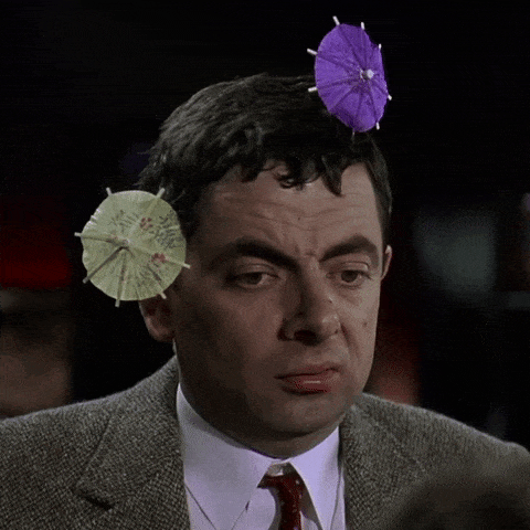 GIF přání k jmeninám Mr.Bean s deštníčky ve vlasech. 