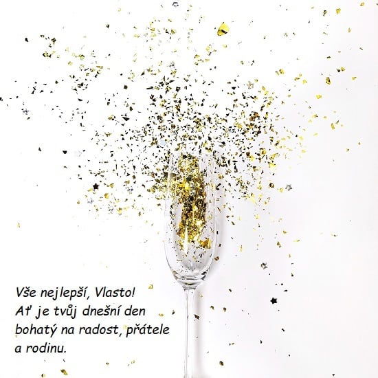 Sklenice na šampaňské plná zlatých konfet s přáním všeho nejlepšího k svátku Vlastovi. 